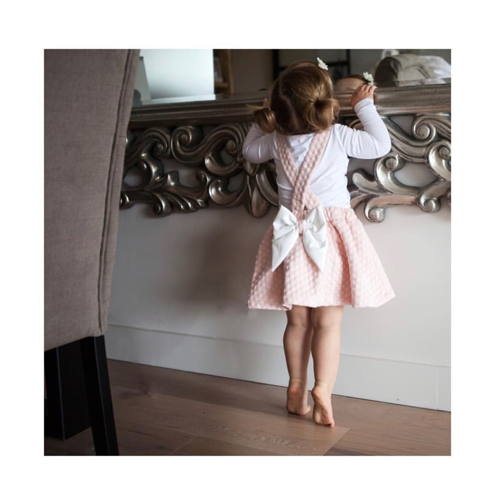 Pink Skirt with button over the shoulder Straps